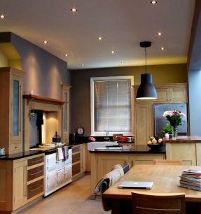 Kitchen interior lighting with downlights and pendant